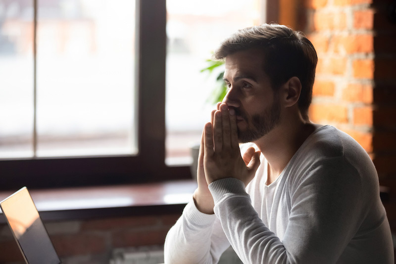 Man thinking at their desk